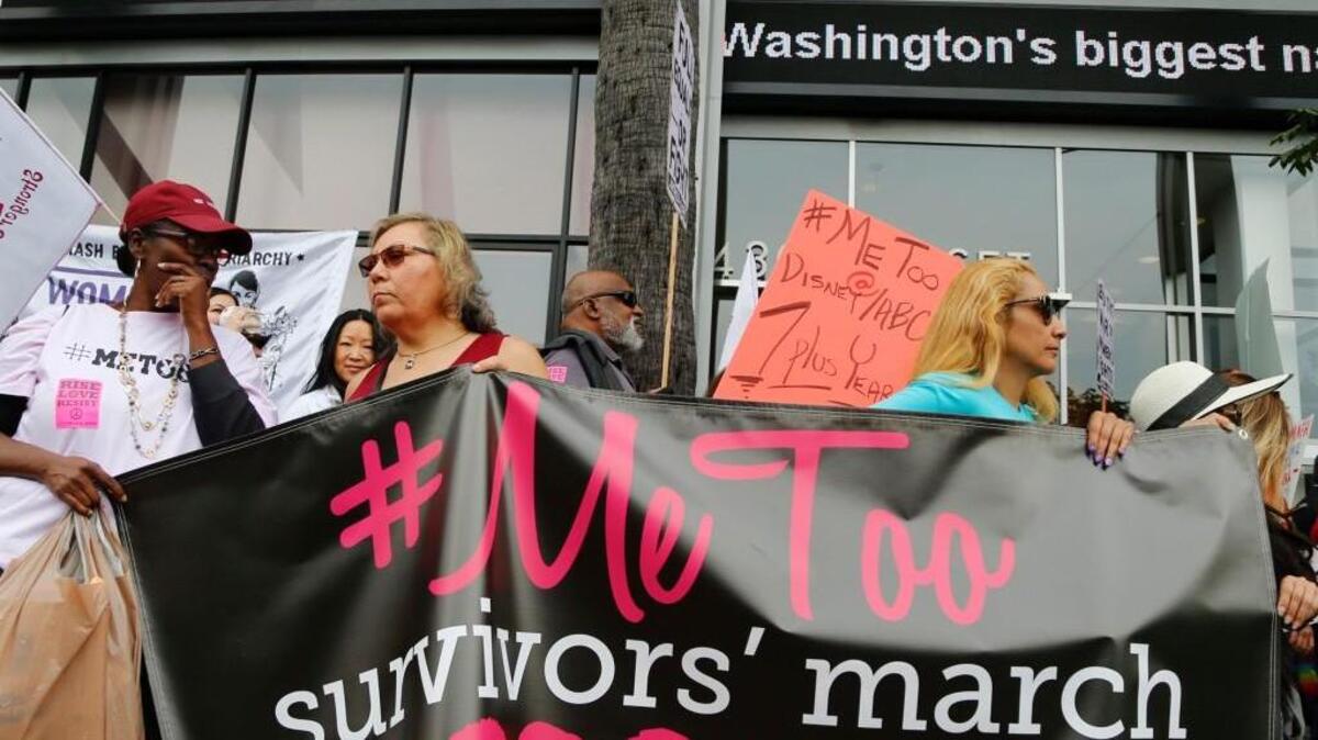 In this Nov. 12, 2017, file photo, participants rally outside CNN's Hollywood studios on Sunset Boulevard to take a stand against sexual assault and harassment for the #MeToo March in the Hollywood district of Los Angeles. A spate of recent public revelations, including the spontaneous #metoo discussions on social media, is emboldening many victims of sexual harassment to speak up, but many still remain silent.