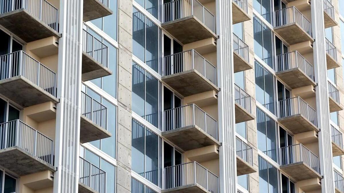 High-rise luxury apartment buildings take a toll on roads with increased traffic.