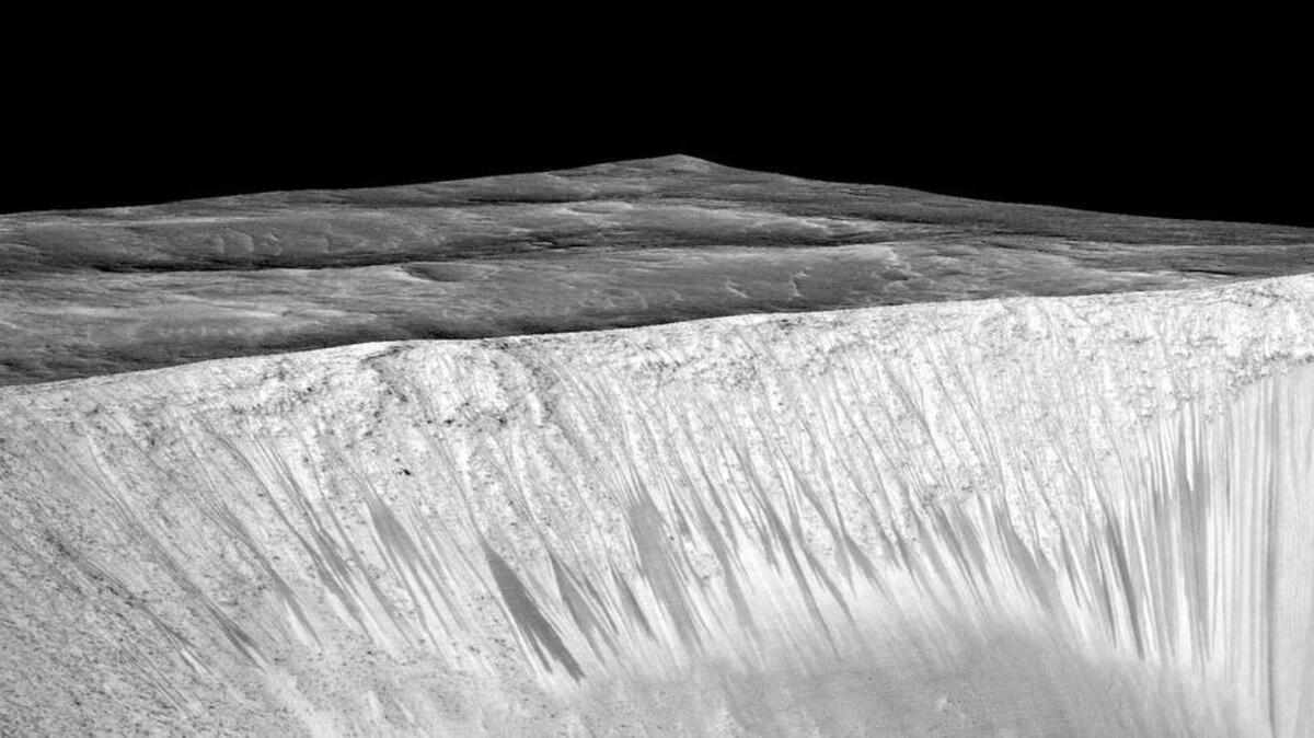 A new study makes the case that dark narrow streaks emanating from the walls of Garni crater on Mars were formed by briny water flowing.