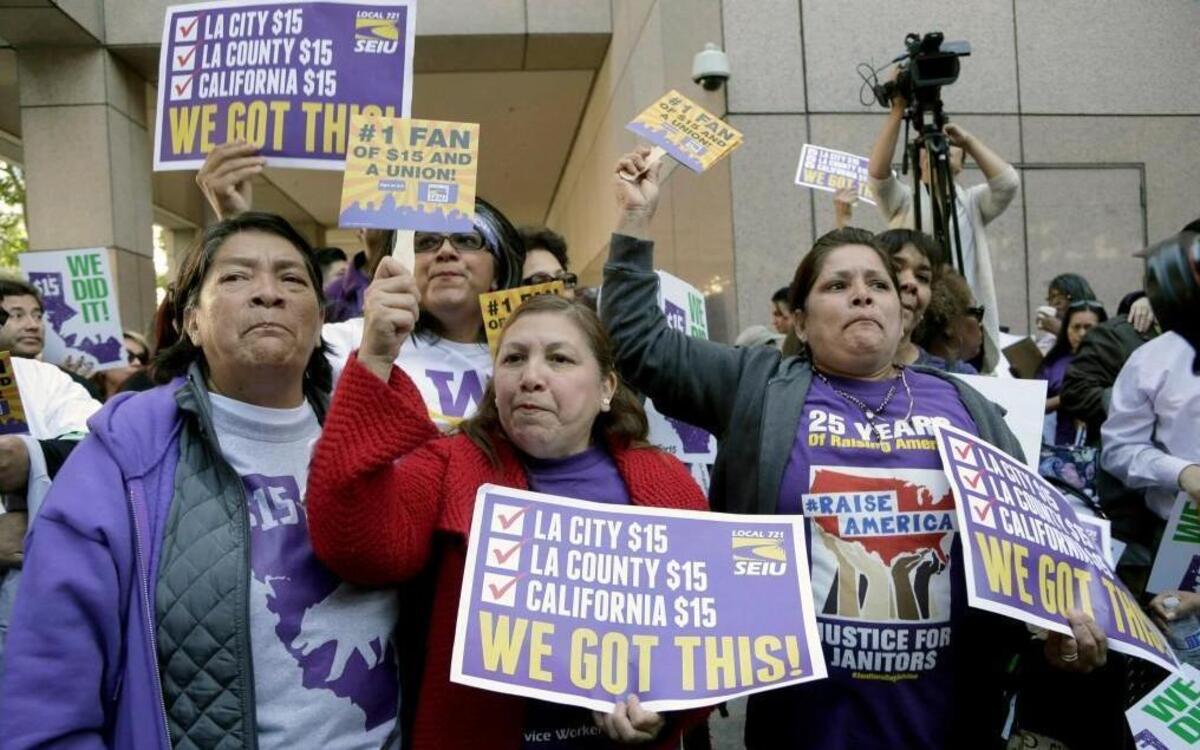 Workers rally in Los Angeles on April 4 after California Gov. Jerry Brown signed a bill to raise the state’s minimum wage to $15 an hour by 2022.