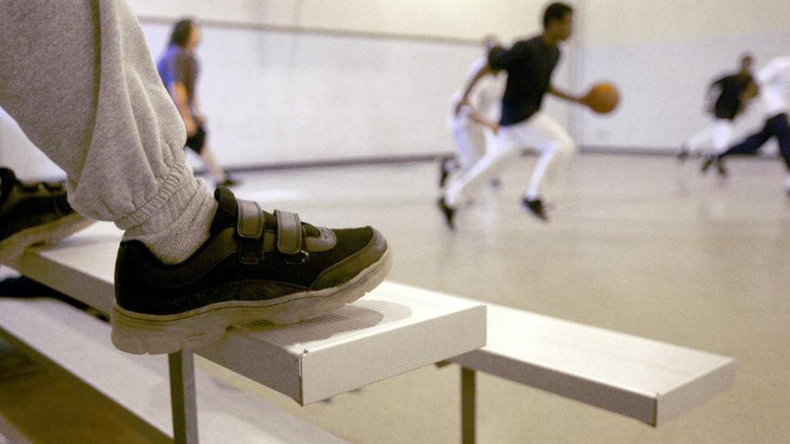 Boys play basketball at a North Carolina juvenile detention facility.