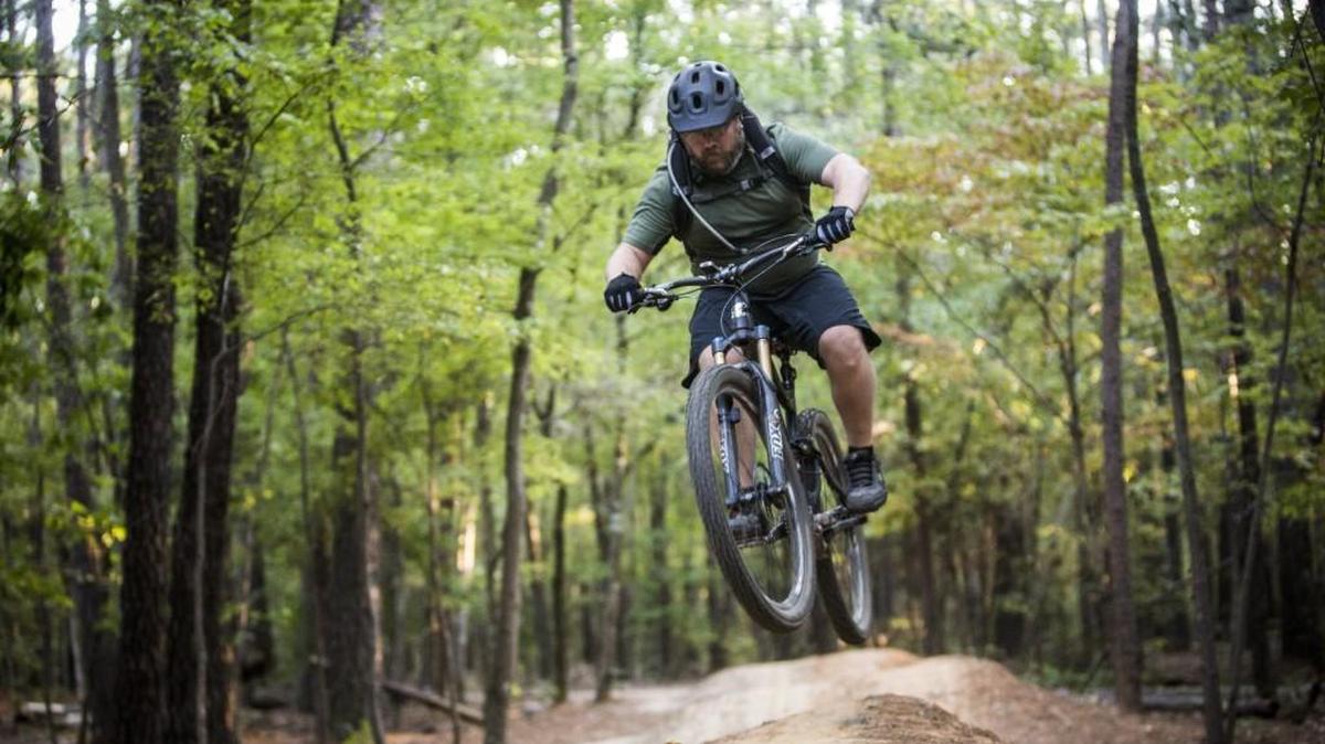 A man rides the popular mountain bike trails at Lake Crabtree County Park in a file photo from 2014. Wake County has leased the land from the airport for decades for a nominal fee.