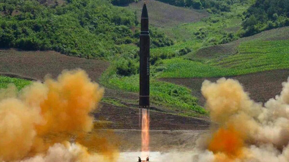 FILE - This file photo distributed by the North Korean government shows what was said to be the launch of a Hwasong-14 intercontinental ballistic missile, ICBM, in North Korea's northwest, Tuesday, July 4, 2017. Donald Trump’s threat to unleash ‘fire and fury’ on North Korea might have been written by Pyongyang’s propaganda mavens, so perfectly does it fit the North’s cherished claim that it is a victim of American aggression.