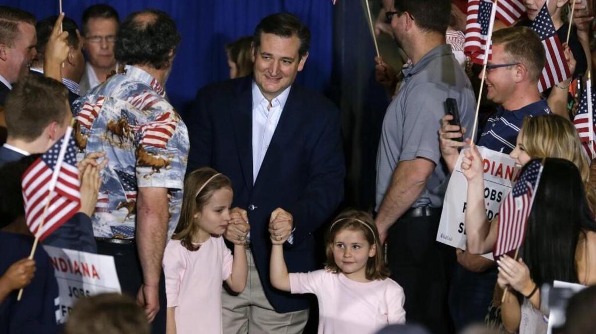Republican presidential candidate Sen. Ted Cruz, R-Texas, takes the stage with his daughters Caroline, left, and Catherine in Indiana.