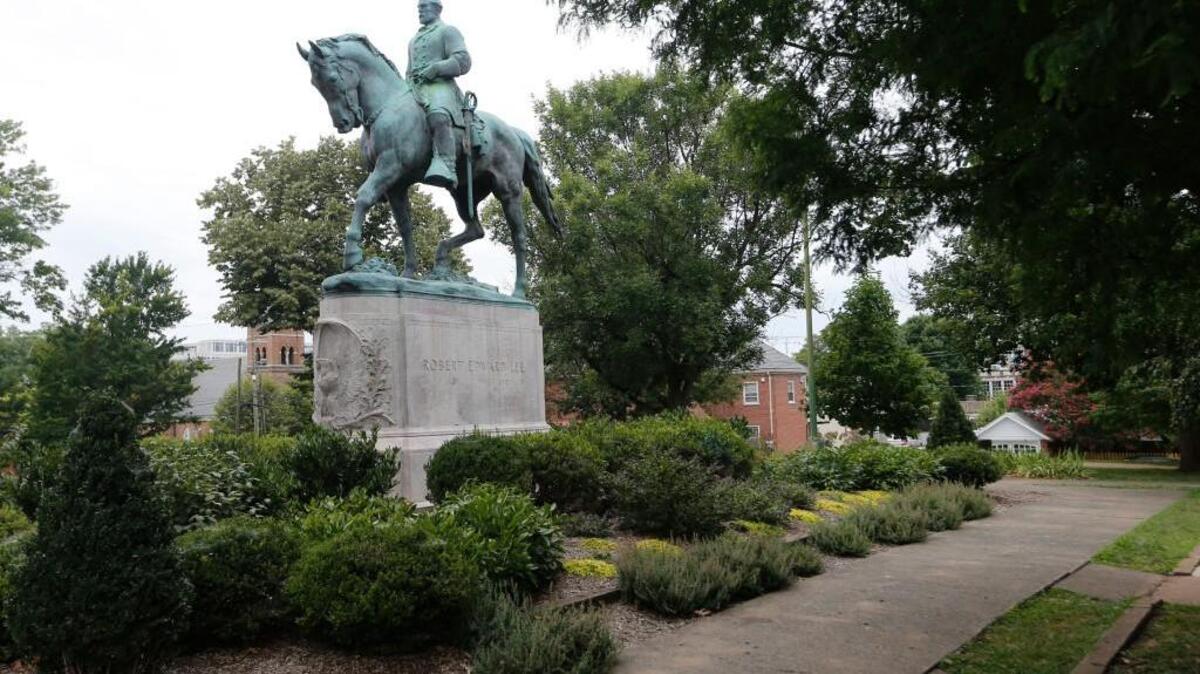 The statue of Confederate General Robert E. Lee still stands in Lee park in Charlottesville, Va., Monday, Aug. 14, 2017. The removal of the statue is in litigation and is at the center of the racial tensions and demonstrations in the town.