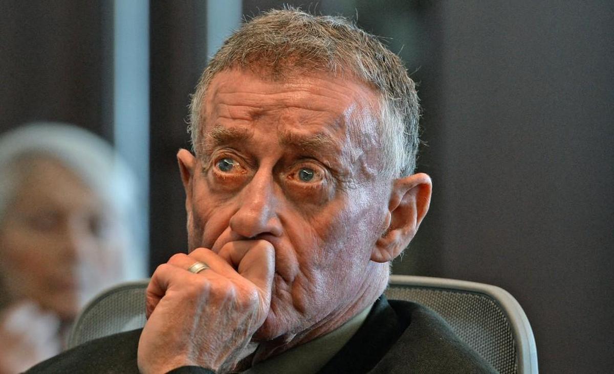 Michael Peterson listens as his attorney David Rudolf speaks during his plea hearing at the Durham County Courthouse in Durham on Feb. 24.