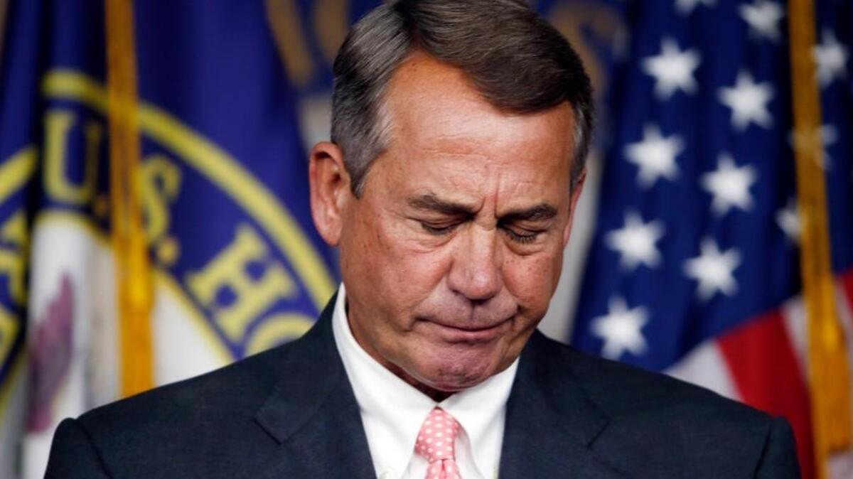 
House Speaker John Boehner of Ohio pauses during a news conference on Capitol Hill announcing he will resign from Congress at the end of October.
