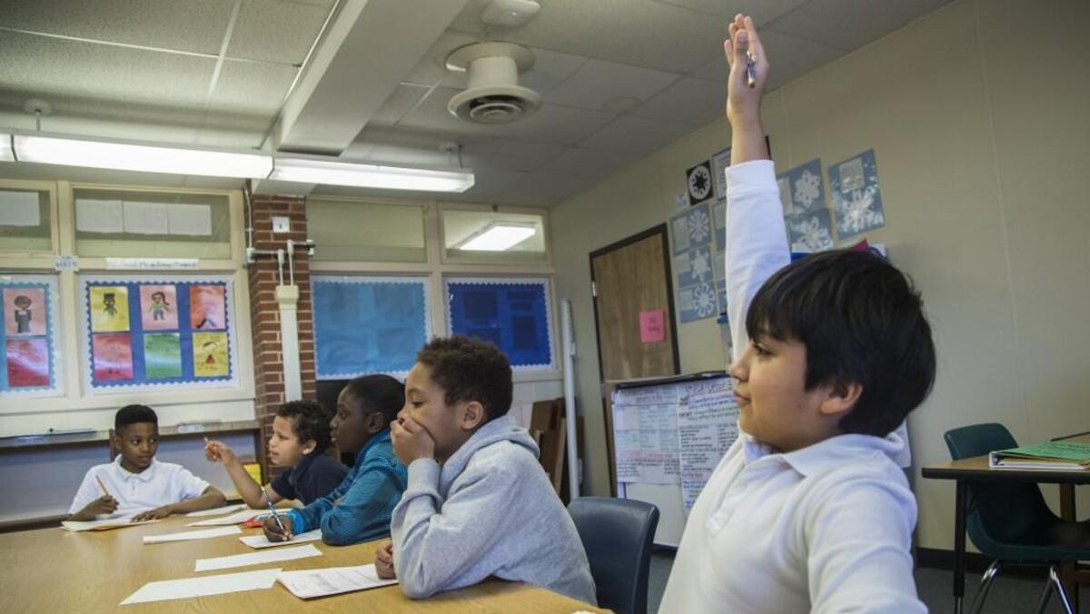 A fifth-grader at Montlieu Academy of Technology in High Point eagerly raises his hand to answer a question during a math class for intellectually gifted students Monday, Feb. 13, 2017. Montlieu is a 95 percent minority and 98 percent free and reduced lunch school yet places a high percentage of students in its gifted program.