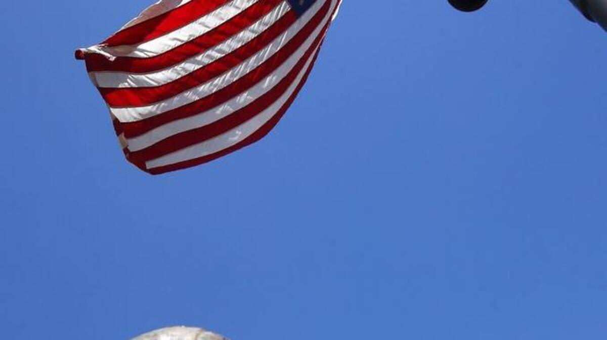 Flags fly at half-staff in remembrance of Arizona native U.S. Navy Petty Officer 1st Class Charles Keating IV near the Arizona Capitol. The Navy SEAL was shot and killed in Iraq.