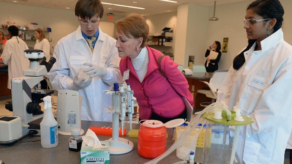 Sue Breckenridge, former executive director of the North Carolina Business Committee for Education (NCBCE) questions students at the RTP Community Lab Tuesday, Oct. 7, 2014 at Biogen Idec's Community Lab located in the Research Triangle Park. The lab is an effort to get high school students more interested in STEM programs. The lab is a dedicated laboratory classroom where students hands-on access to real-world science.