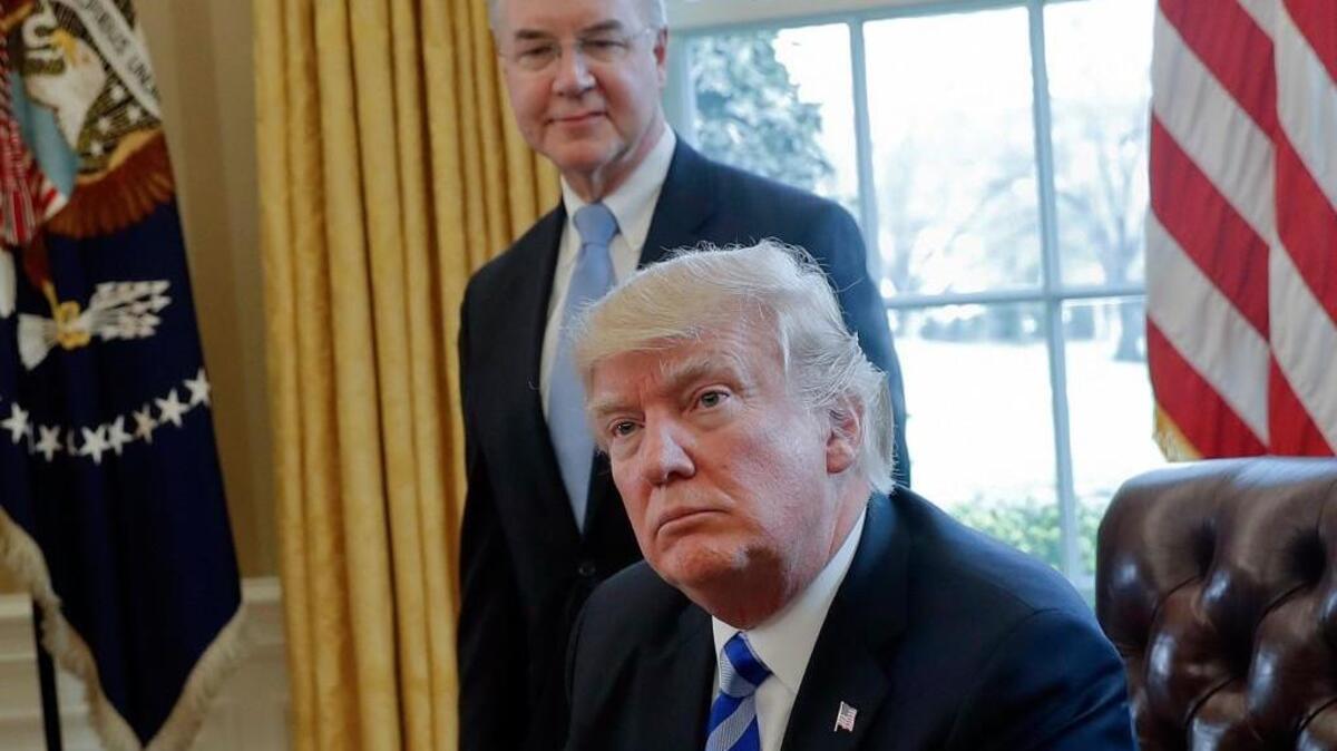 FILE - In this March 24, 2017 file photo, President Donald Trump with Health and Human Services Secretary Tom Price are seen in the Oval Office of the White House in Washington. Price resigned Sept. 29, after his costly travel triggered investigations that overshadowed the administration's agenda and angered his boss. Price's regrets and partial repayment couldn't save his job.