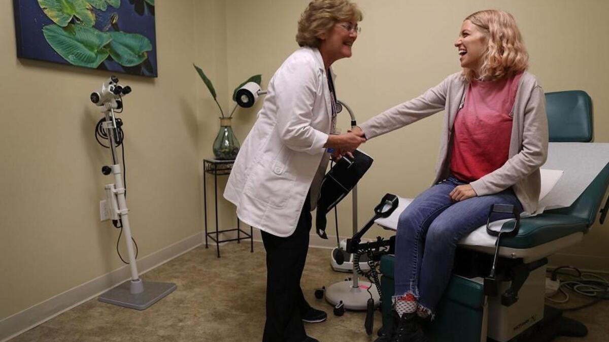 Madison Tolchin visits Paula Glass, an advanced registered nurse practitioner, for a health checkup April 14 at a Planned Parenthood clinic in Wellington, Fla.