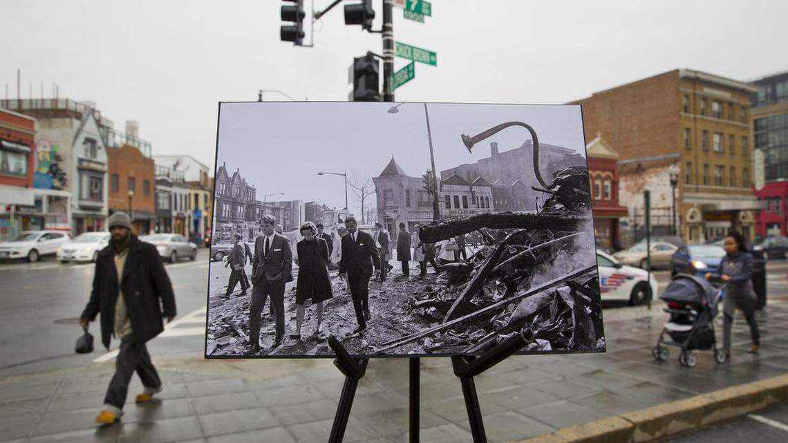 An April 7, 1968, photo showing Sen. Robert F. Kennedy, D-N.Y., stepping through the debris of a building razed by fire during a 22-block tour on foot through a badly damaged area in northwest Washington. The April 4, 1968 assassination of Martin Luther King Jr. sparked rioting across neighborhoods in Washington.