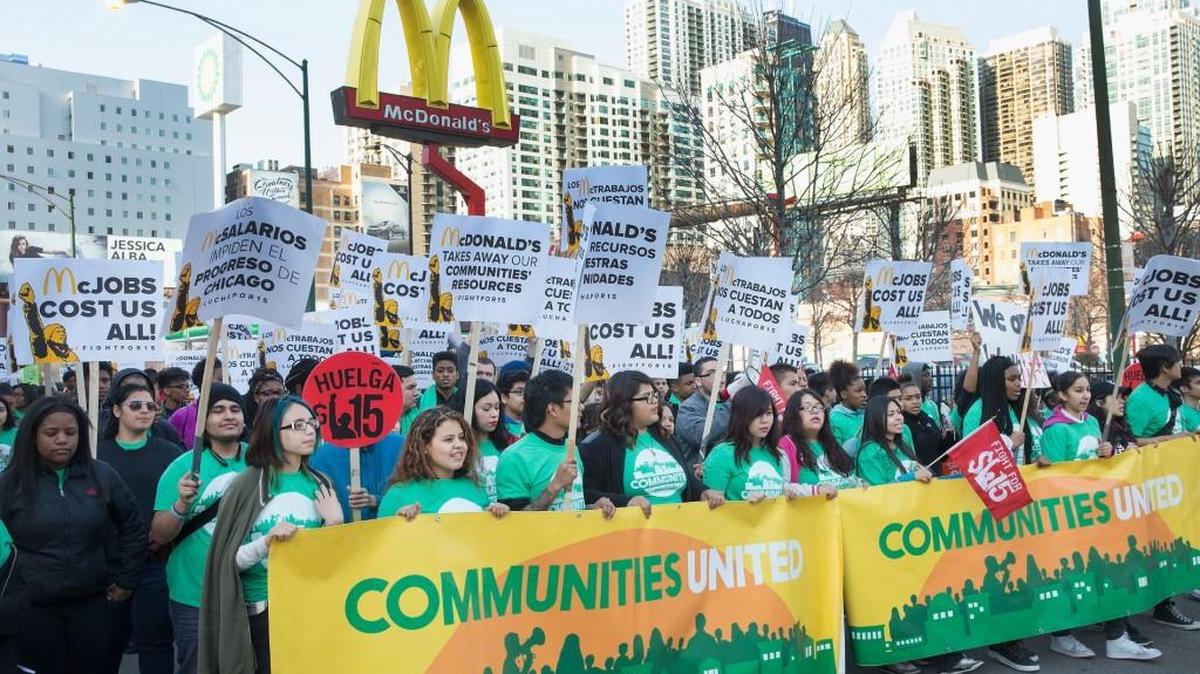 Demonstrators demanding an increase in the minimum wage to $15-dollars-per-hour march around a McDonald's restaurant on April 14, 2016 in Chicago, Illinois. The demonstrators marched to and protested in front of several locations during a day-long effort to draw attention to low-wage jobs.