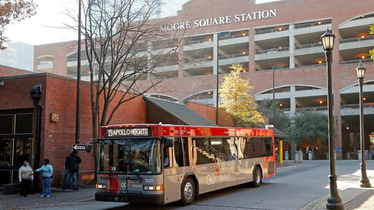 A Raleigh city bus painted in the new color scheme departs from Moore Square Transit Station in downtown Raleigh in 2015.