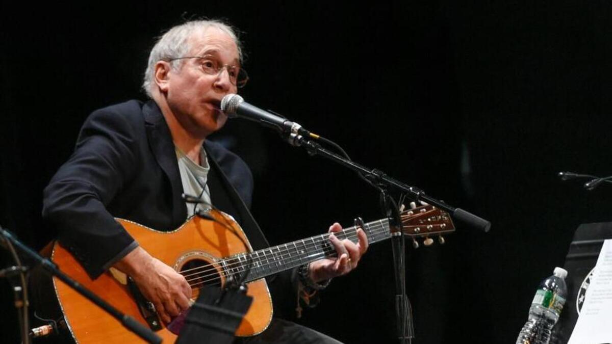 In this Oct. 6, 2015 file photo, Paul Simon participates in the Country Music Hall of Fame benefit concert in New York. S