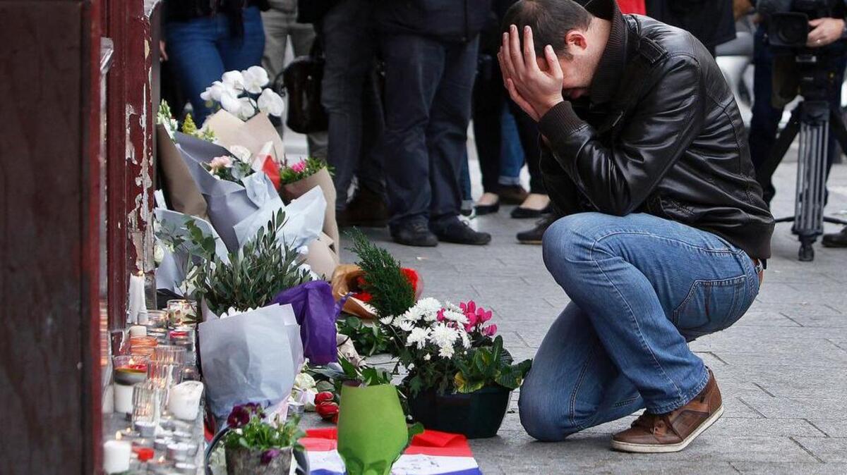 A memorial in front of the Carillon cafe in Paris.