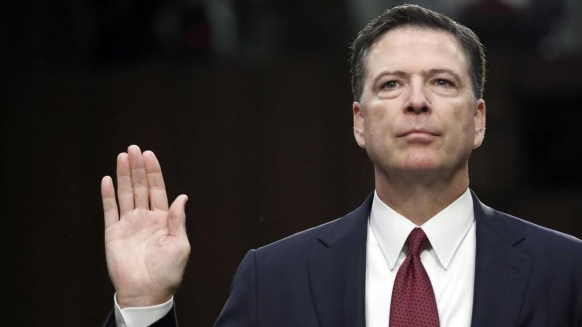 Former FBI Director James Comey is sworn in during a Senate Intelligence Committee hearing on Thursday.
