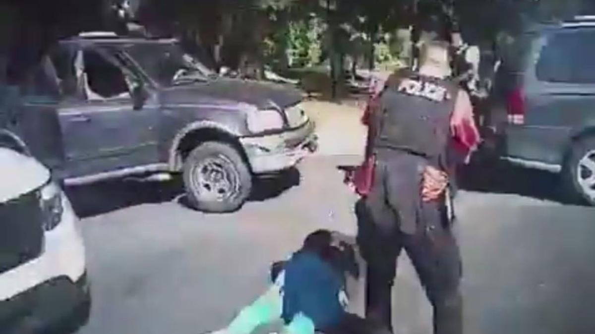 Police body camera screen grab from a Charlotte-Mecklenburg Police Department video shows Keith Lamont Scott lying on the ground after being shot.