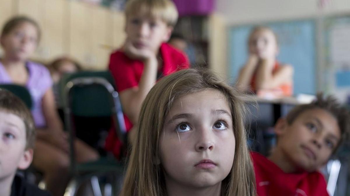 Fifth grader Madeline Quinn listens to a presentation on the solar system at Powhatan Elementary School in in Clayton last September.