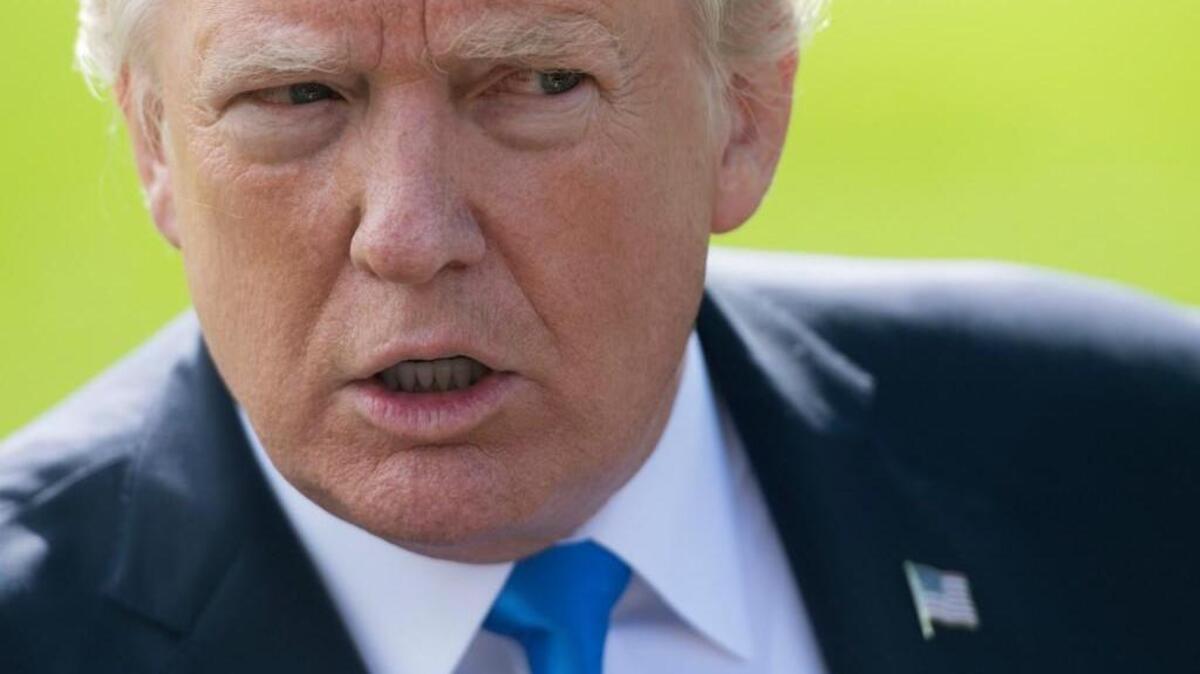 This file photo taken on October 25, 2017 shows US President Donald Trump prior to departing on Marine One from the South Lawn of the White House in Washington, DC. President Donald Trump dismissed explosive indictments against three campaign aides on October 30, 2017, insisting there was no collusion with Russia and calling on political rival Hillary Clinton to be investigated. Trump lashed out as his campaign chairman Paul Manafort, along with another aide, faced a battery of federal conspiracy charges, and an unsealed indictment showed advisor George Papadopoulos pled guilty weeks ago to lying about Russia links.