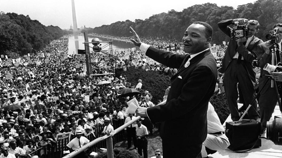 Martin Luther King waves from the steps of the Lincoln Memorial during the "March on Washington" in 1963.
