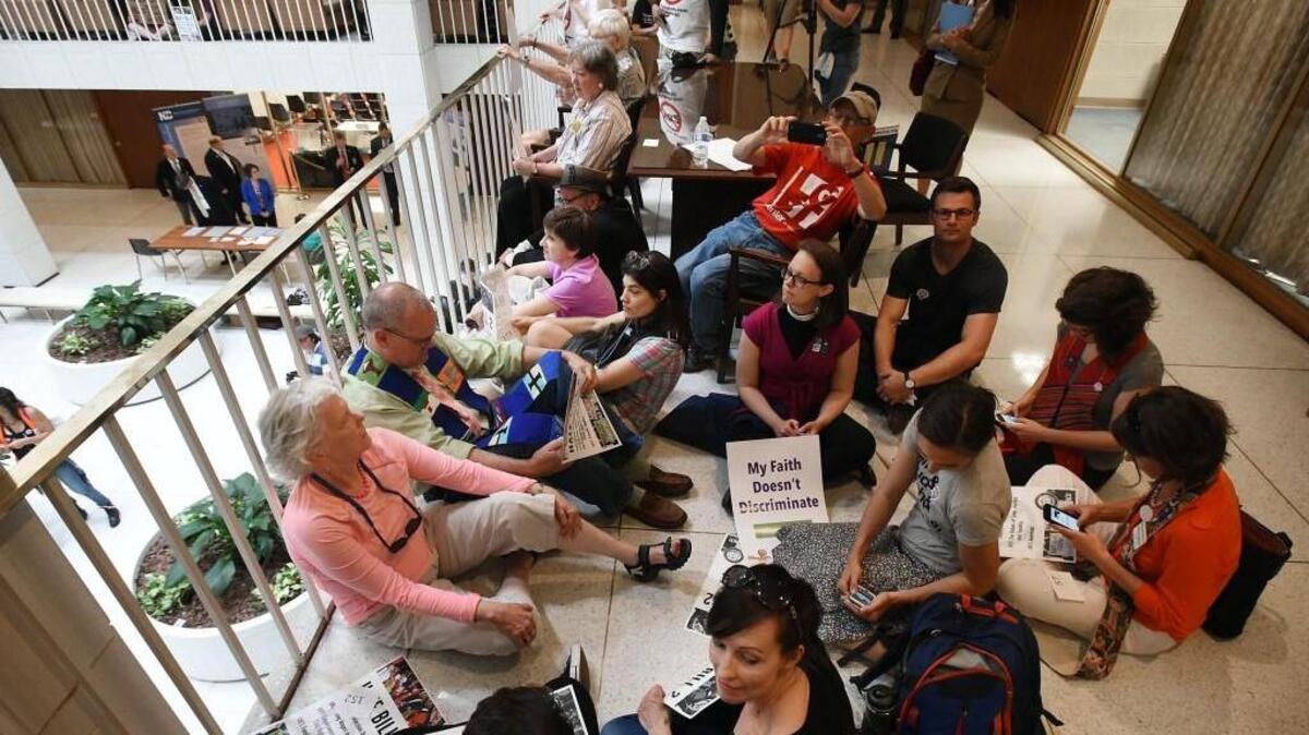HB2 protesters hold a sit-in on the second floor of the legislative building after a rally in Raleigh.