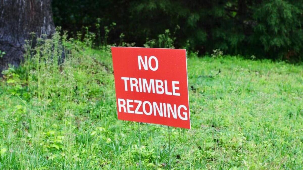 A sign protests the potential rezoning of land in a Cary neighborhood where Habitat for Humanity of Wake County wants to build homes.