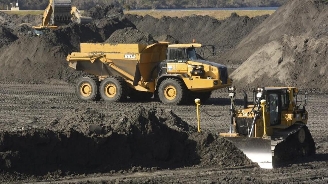 In this photo, crews with Duke Energy continue to remove coal ash from the old coal ponds at the Sutton Plant, in Wilmington, N.C.