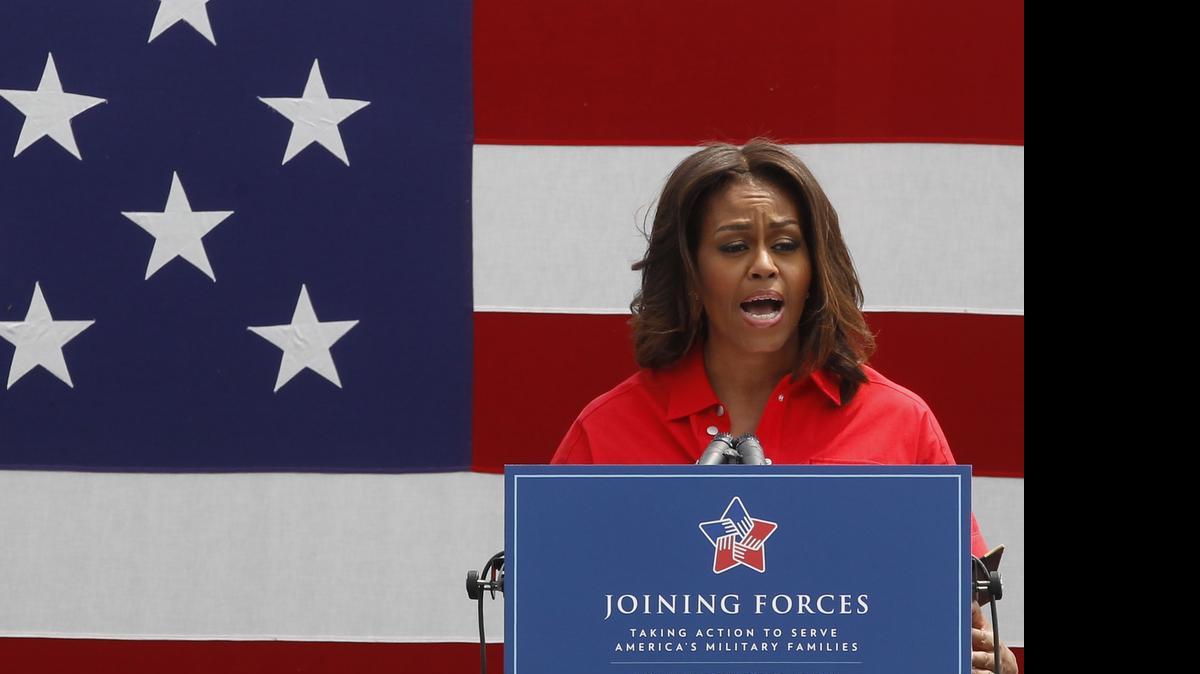 
U.S. first lady Michelle Obama gives a speech as she arrives to meet with soldiers and their families at the U.S. Army Garrison Vicenza, northern Italy.
