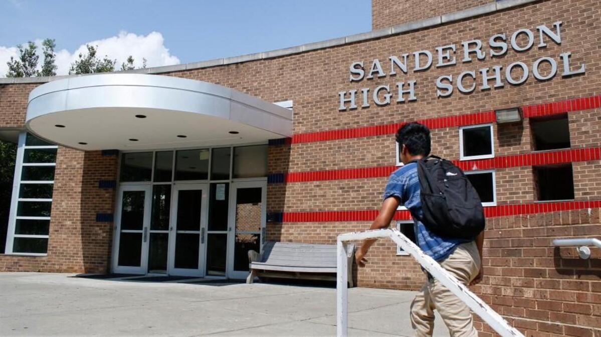 A student makes his way toward the front main entrance to Sanderson High School, Raleigh, NC Thursday, September 1, 2016.