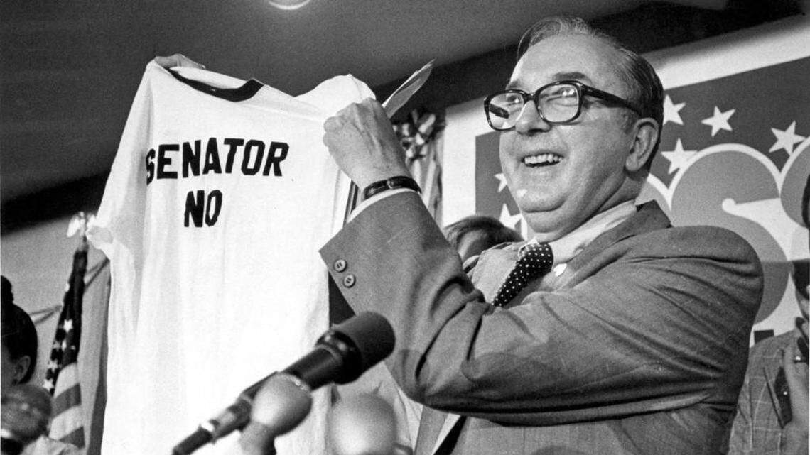 Sen. Jesse Helms, R-N.C., holds up a “Senator No” T-shirt, in Raleigh, N.C., after he was re-elected for a second term in this Nov. 7, 1978, photo.