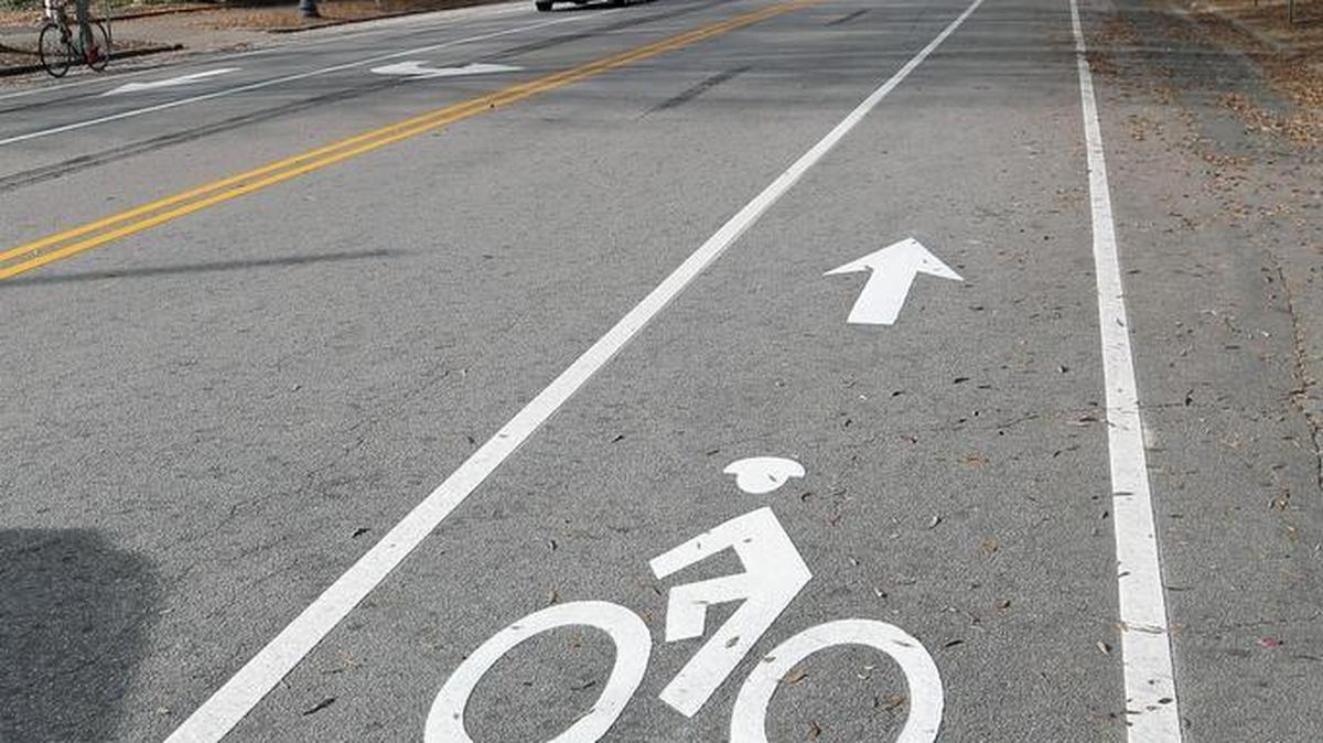 Center lanes on many Raleigh streets have been moved to left here, to the right there. Automobile lanes have been made fewer or narrower. All to make room for miles and miles of new bike lanes on Raleigh city streets, like this one on Hillsborough St. near McDowell St. in downtown Raleigh.