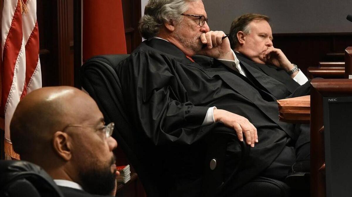 A trio of Superior Court Judges (from left) Todd Burke, Judge Jesse Caldwell and Judge Jeffrey Foster listen to lawyers at the Wake County Courthouse in February. A new state law will change the previously nonpartisan election of superior and district court judges to partisan elections.