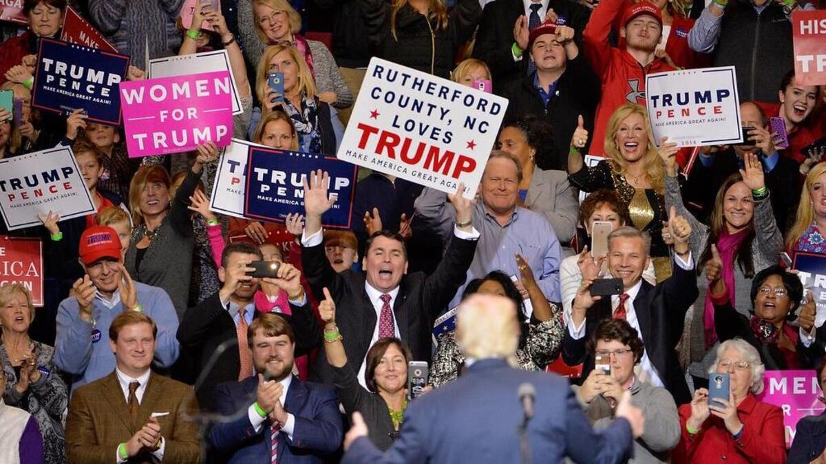 People cheer for President-elect Donald Trump at Crown Coliseum on Dec. 6, 2016 in Fayetteville. Trump is promising to bring back good paying jobs, but his proposals for tax cuts and reduced regulation won’t help working people.