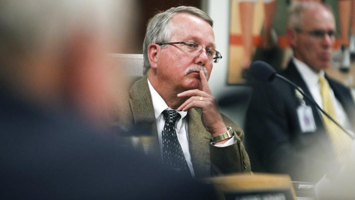 Wake County school board member Tom Benton listens to a public speaker session in 2014 during a Wake County school board public hearing on the 2015-16 student assignment proposal.