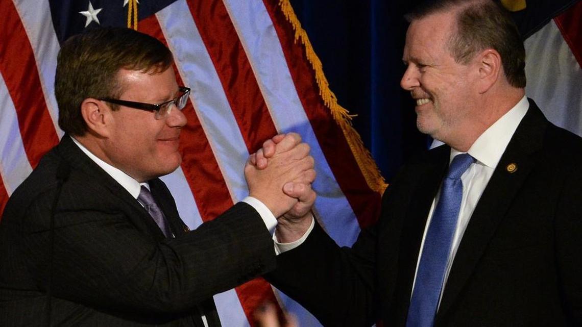 Senate Pro Temp Phil Berger (right) and Speaker of the House Tim Moore congratulate each other for gaining seats in the state legislature on Nov. 8, 2016. The Republican leaders are committed to a fiscal policy of cutting taxes and restricting state spending.