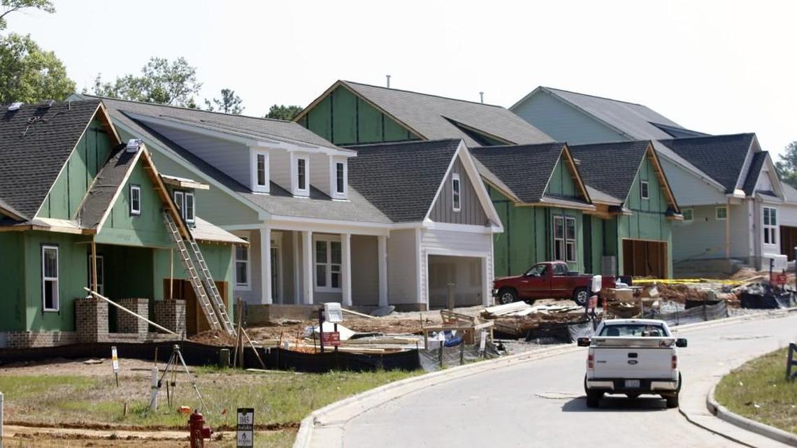 A row of new single family homes are under construction along Sour Mash Court in the new 12 Oaks subdivision in Holly Springs in 2015. Growth has exploded in the Holly Springs/Apex area in recent years.