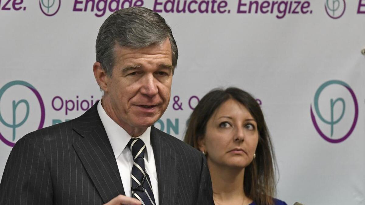 North Carolina Gov. Roy Cooper and Mandy K. Cohen, Secretary of the N.C. Department of Health and Human Services answer questions from the media at the Opioid Misuse & Overdose Prevention Summit in Raleigh, N.C., Tuesday June 27, 2017.