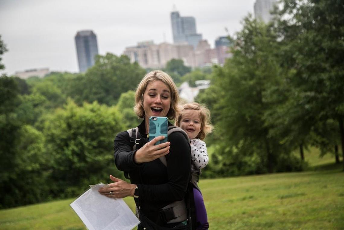 Jennifer Hoverstad, a parks and recreation board member, takes a photograph with her daughter during a weekly guided tour of Dix Park in 2016.