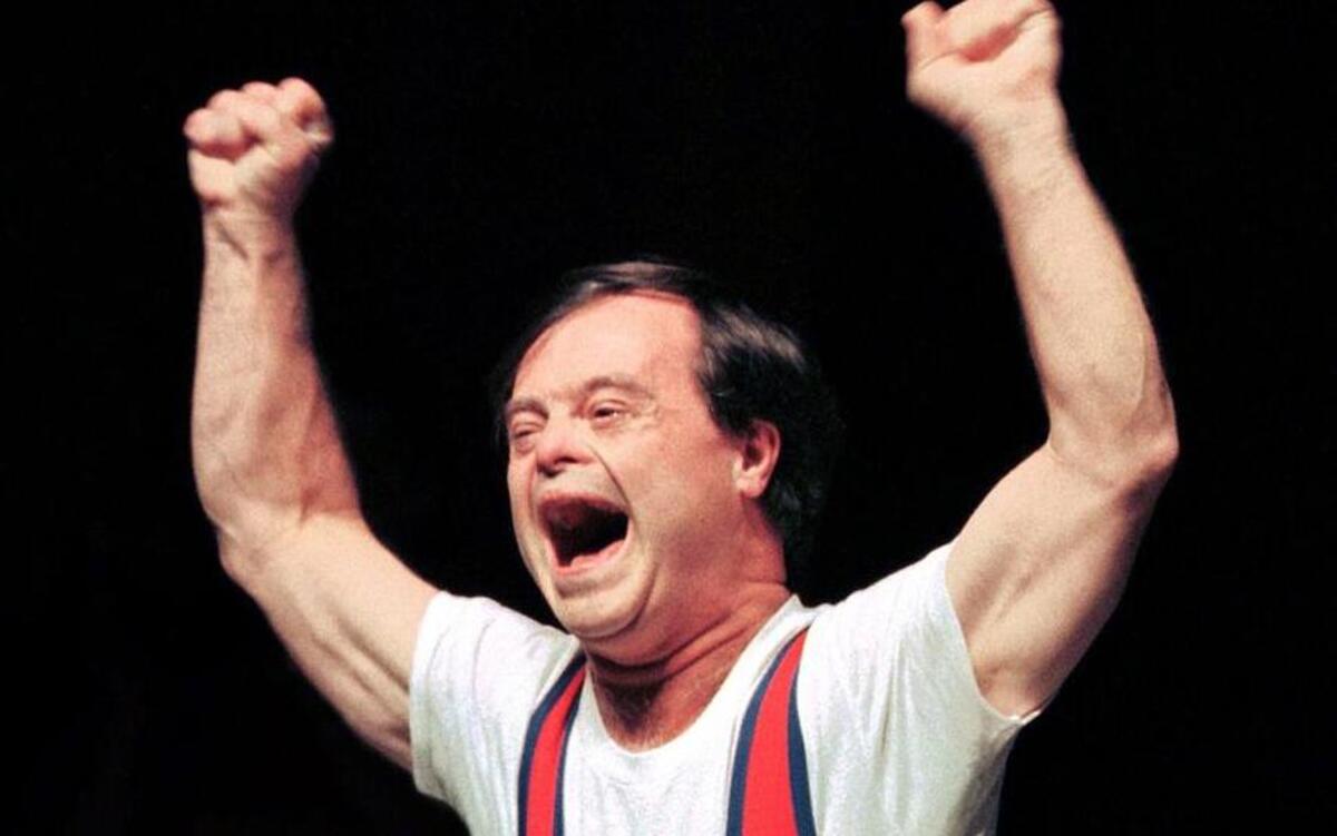 
Marty Sheets celebrates while competing in the deadlift competition  at the 1999 Special Olympics World Summer Games in Raleigh.
