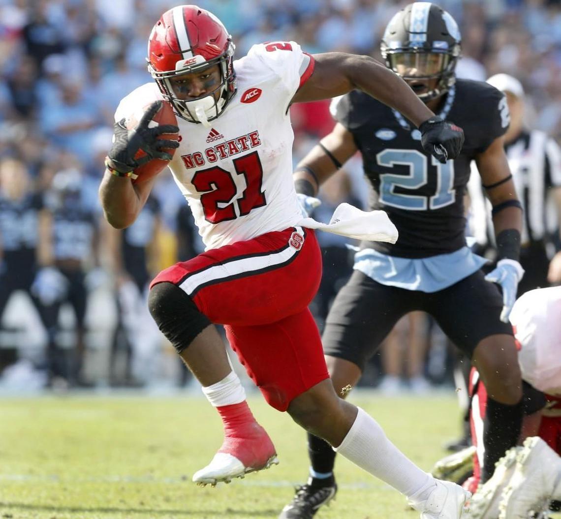 N.C. State running back Matt Dayes (21) breaks free for an 18-yard touchdown run during the first half of the Wolfpack’s game against UNC at Kenan Stadium in Chapel Hill, N.C., Friday, Nov. 25, 2016.