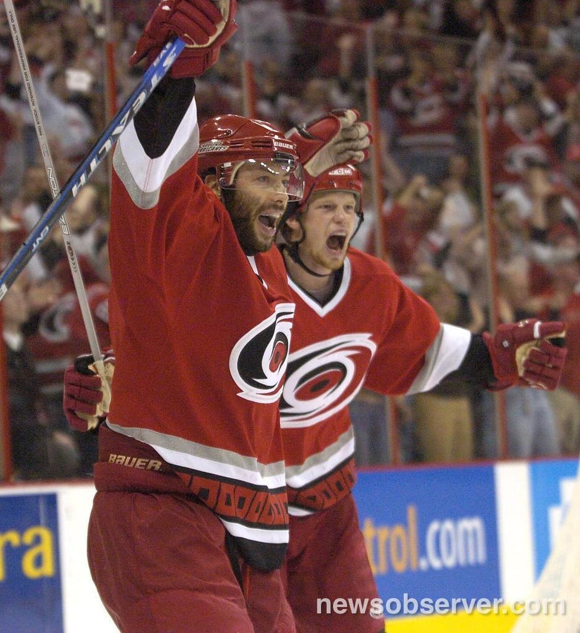Carolina Hurricanes’ Matt Cullen, left, and Eric Staal celebrate Cullen’s goal during the first period of Game 5 of an NHL playoff game between the Carolina Hurricanes and the New Jersey Devils at the RBC Center in Raleigh May 14, 2006. The Canes beat the Devils to win the series 4-1 and advanced to the Eastern Conference finals to face the Buffalo Sabres.