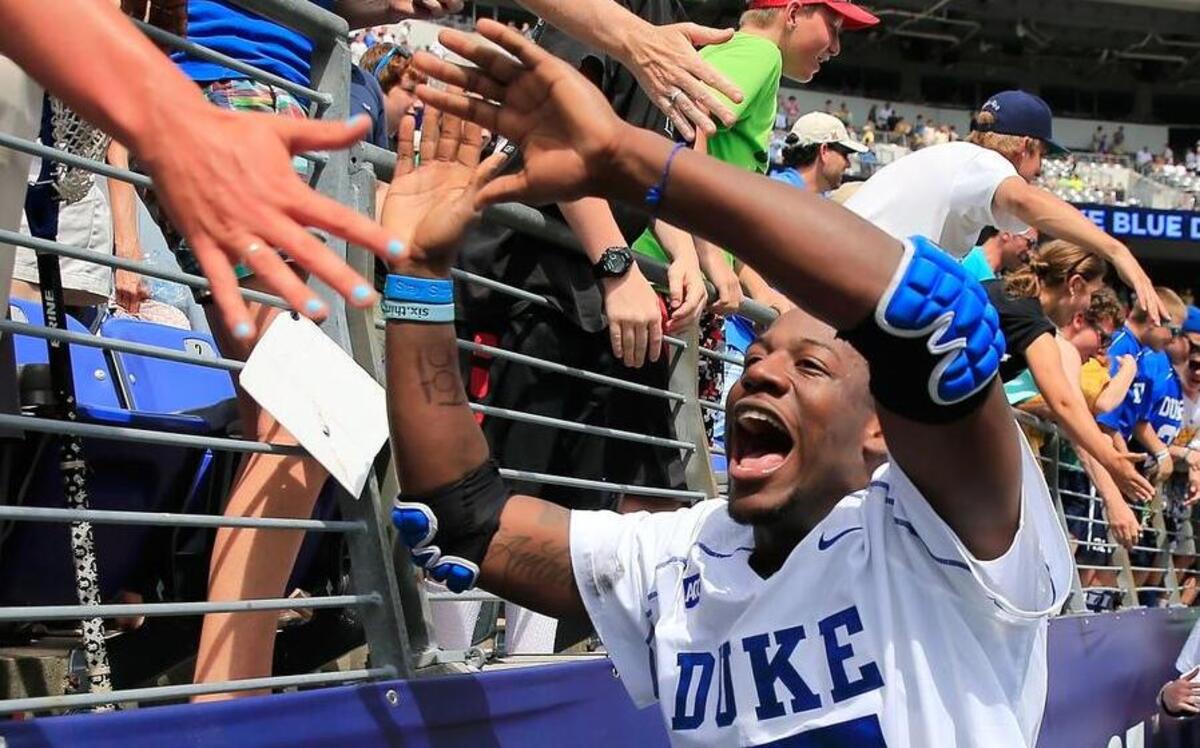 
Duke’s Myles Jones #15 celebrates with fans after Duke defeated the Notre Dame Fighting Irish 11-9 to win the 2014 NCAA Division I Men's Lacrosse Championship at M&T Bank Stadium on May 26, 2014 in Baltimore, Maryland. 
