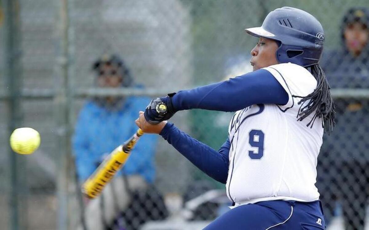
St. Augustine softball player Jo'Landa White bats during a CIAA Tournament game against Bowie State at Walnut Creek fields in Raleigh on April 30, 2015. She has Brachial Plexus Birth Palsy which means she can't fully extend her left arm. Despite her disability, she has been one of the top hitters on the St. Aug's softball team for the last few years. 
