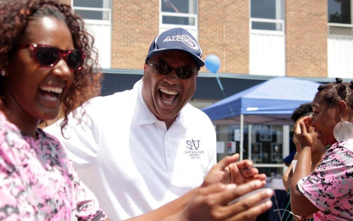 
St. Augustine President Everett Ward dances alongside freshman softball third baseman Akera McPhaul (left) at a pep rally on Wednesday, May 6, 2015, to celebrate the softball team’s conference championship.
