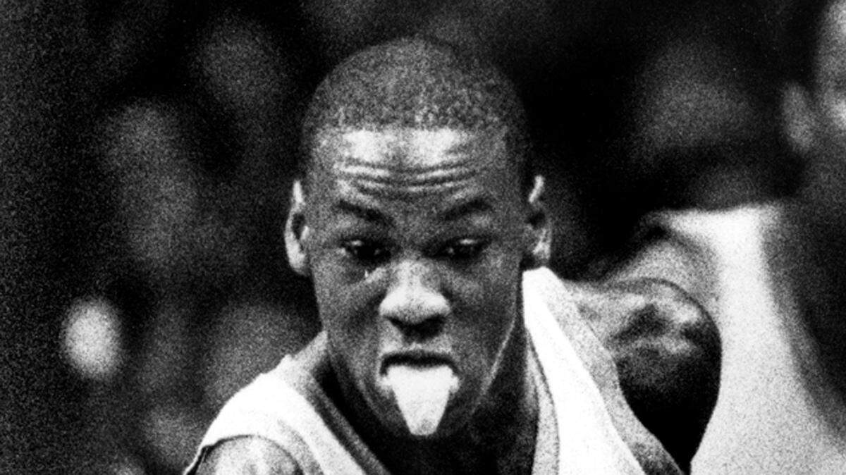 Michael Jordan heads down court after making a steal from Vilanova's Ed Pickney March 21, 1982.