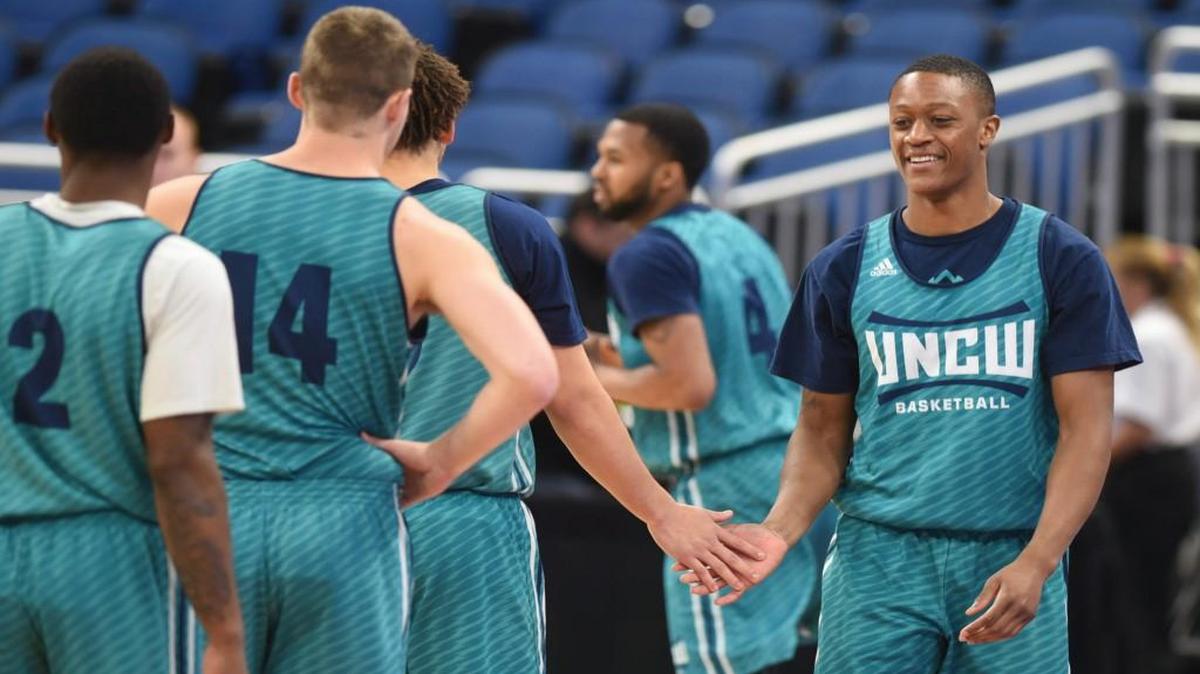 UNC Wilmington guard C.J. Bryce gets hi-fives from teammates during an NCAA practice session at the Amway Center in Orlando, Fla., Wednesday, March 15, 2017. The team was preparing for its first round NCAA tournament game against Virginia on Thursday.