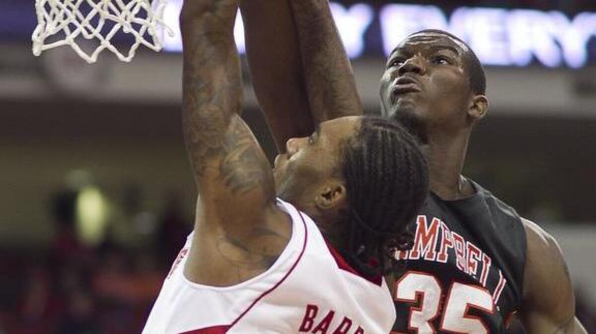Campbell's D.J. Mason, right, blocks a shot by N.C. State's Anthony Barber during the first half of their game Nov. 16, 2013. Mason is a preseason All-Big South second-team pick and averaged 11.2 points and 5.2 rebounds per game, and shot 50.3 percent last season.