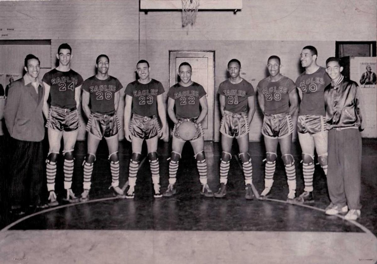 The NCCU team that defeated Duke in 1944's 'secret game.' From left: Coach John B. McLendon, George Parks, an unidentified player, Billy Williams, James Hardy, Aubrey 'Stinkey' Stanley, Floyd Brown, Henry 'Big Dog' Thomas and manager Edward 'Pee Wee' Boyd. KYLE SERBA